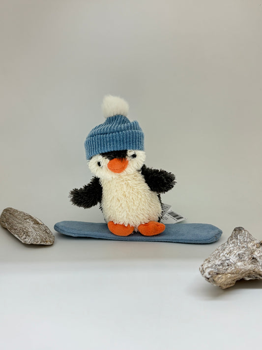 Pinguouin en snowboard, peluche dessinée à Londres Jellycat PNS3SB