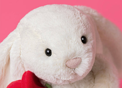 Lapin crème avec rose peluche dessinée à Londres